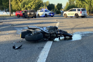 A motorcycle lies in the road after it was involved in a crash Sept. 6, 2023, with multiple vehicles at the intersection of Northeast 50th Avenue and St. Johns Road north of the Walnut Grove area. The rider suffered significant injuries to his arms and leg. (Contributed by the Clark County Sheriff&rsquo;s Office)