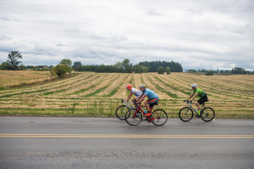 Bicyclists approach the Clark County Fire & Rescue Station 24 in Ridgefield in 2019 while riding the 68-mile Bike Around Clark County loop. Bicyclists chose from five route lengths offered by Ride Around Clark County and organized by the Vancouver Bike Club. (The Columbian file photos)
