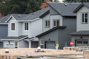 Workers construct Fircrest Meadows in November in Vancouver. For generations, a starter home was the first rung on the homeownership ladder. But now, many buyers face the challenge that the next step is too far away to grasp. (The Columbian files)