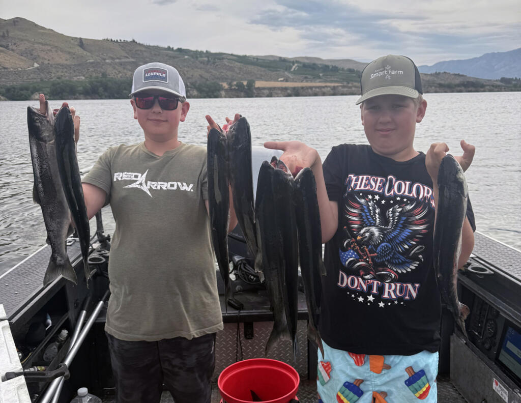 A pair of youngsters with Columbia River sockeye. Fishery managers will monitor the run this year, to see if additional sockeye retention days can be added to the fishing calendar. (Photo by Brad Wagner)
