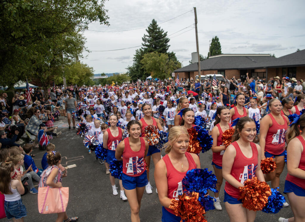 Ridgefield High School cheerleaders march July 4, 2025, during the Fourth of July parade in Ridgefield. (Taylor Balkom/The Columbian files)