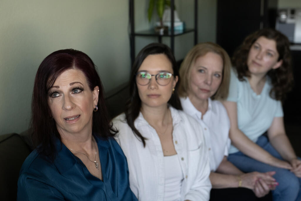 YWCA&rsquo;s Domestic Violence High Risk Team volunteers Kristi Hafdahl, Jade Embry, Pamela Paulsen and Kirsten David take a break at the YWCA. The YWCA&rsquo;s Domestic Violence High Risk Team has lost funding. (Amanda Cowan/The Columbian)
