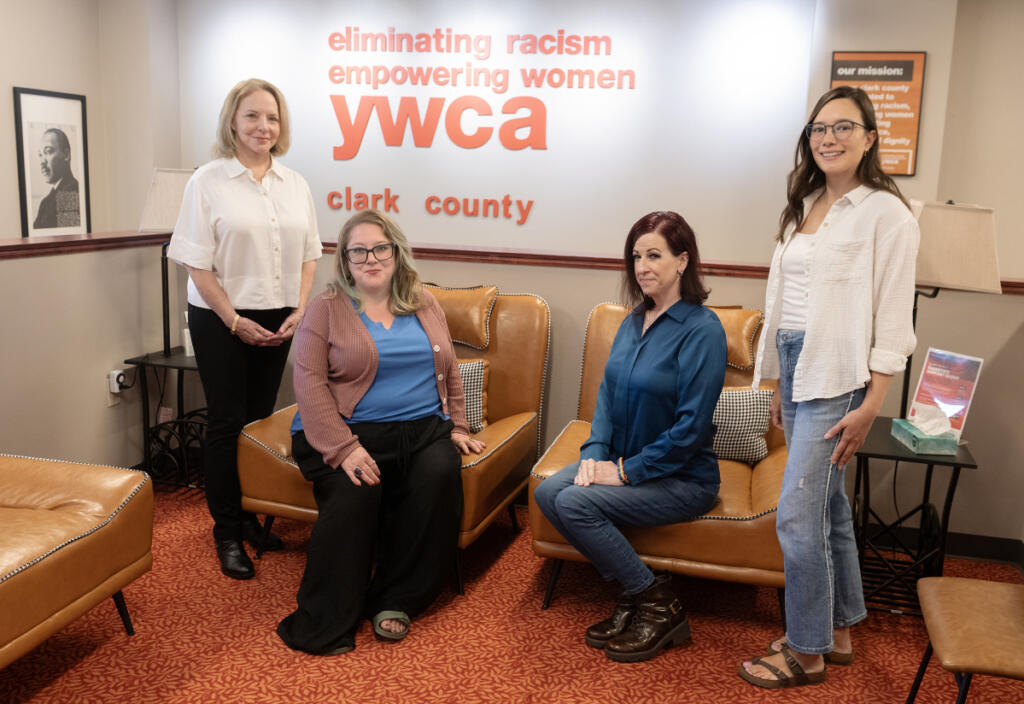 YWCA&rsquo;s Domestic Violence High Risk Team volunteer Pamela Paulsen, from left, joins the team&rsquo;s specialist Malerie Paynter and fellow volunteers Kristi Hafdahl and Jade Embry at the YWCA&rsquo;s Vancouver offices on Thursday morning. (Amanda Cowan/The Columbian)