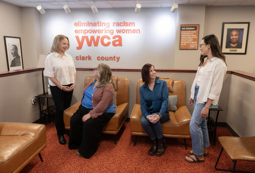 YWCA&rsquo;s Domestic Violence High Risk Team volunteer Pamela Paulsen, from left, joins the team&rsquo;s specialist Malerie Paynter and fellow volunteers Kristi Hafdahl and Jade Embry at the YWCA&rsquo;s Vancouver offices on Thursday morning. (Amanda Cowan/The Columbian)