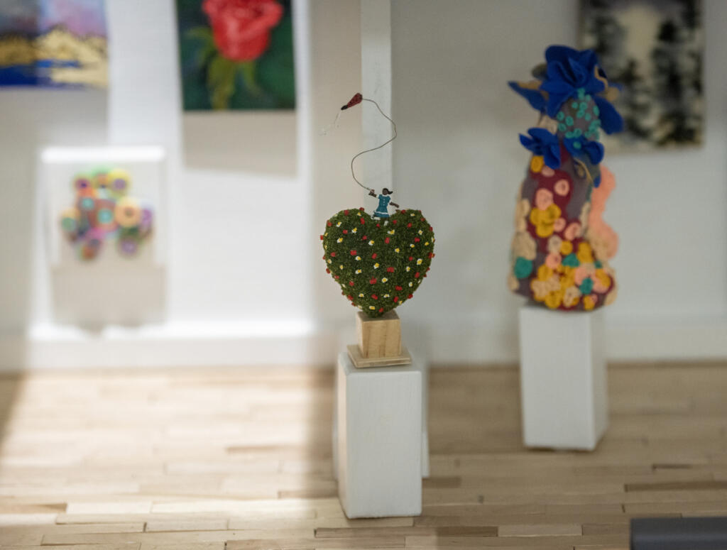 A miniature heart by artist and mini-gallery designer Lara Blair sits atop a tiny, custom-made pedestal. Actual tiny artworks are displayed inside a new miniature art gallery at Gallery 408 in downtown Camas. All of the tiny artworks are for sale, ranging from $40 to $120. (Taylor Balkom/The Columbian)