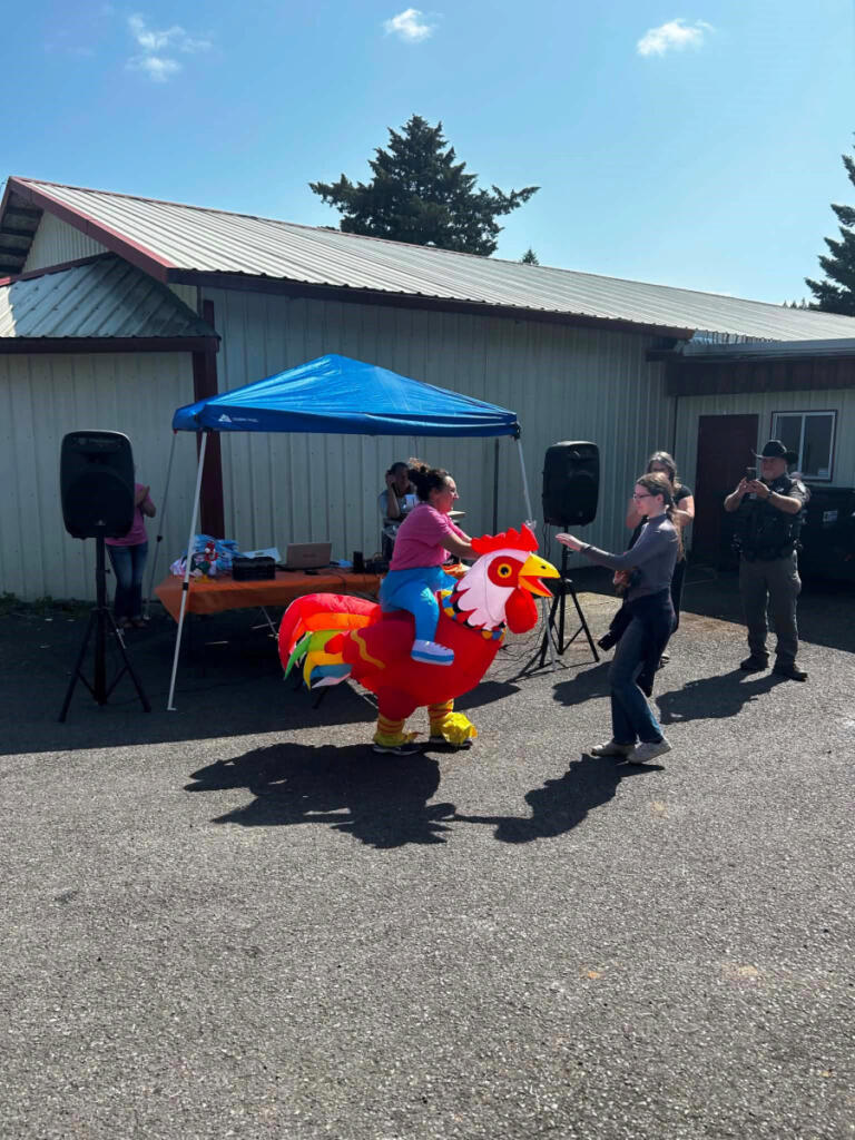 An attendee rides an inflatable chicken during the 2025 Chicken Fashion Show in Yacolt. (Contributed by Jordana LaSalle)