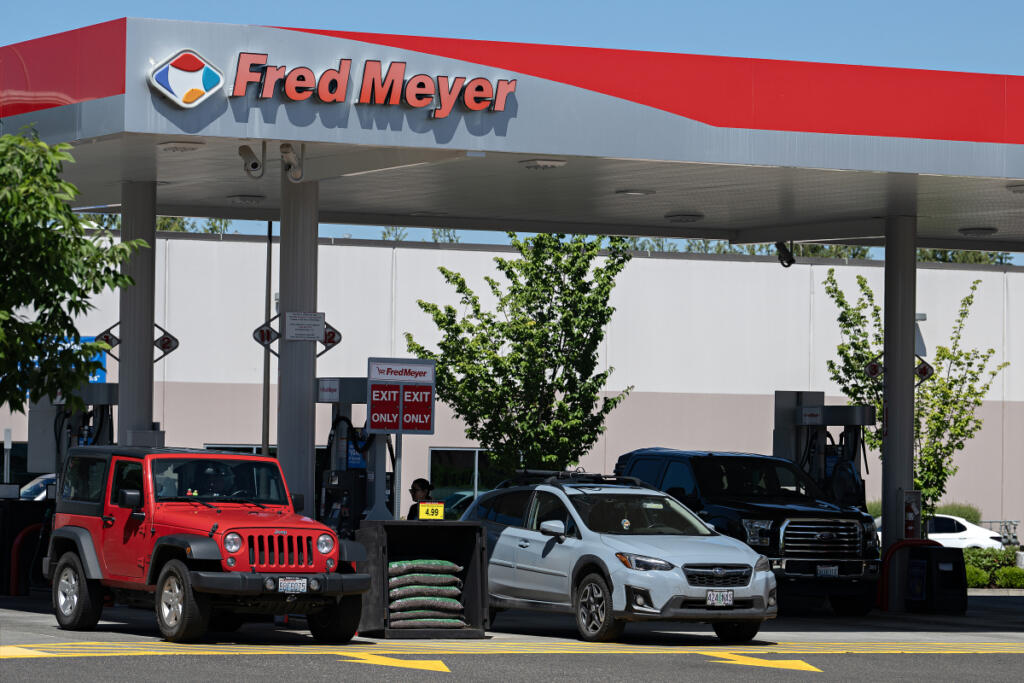 Customers stop by the gas station near the Fred Meyer in Salmon Creek to fill up their tanks Monday morning. Gas prices were up nearly 30 percent in April compared with the previous year, according to the latest Seattle-area consumer price index.