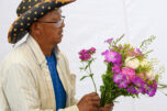 Richard Xiong arranges a bouquet June 3 at the Xiong Flower Farm booth at the Camas Farmers Market. &ldquo;We&rsquo;re so excited, even with the new location,&rdquo; said Leah Nichelson, the market&rsquo;s manager and vendor liaison. (Taylor Balkom/The Columbian)