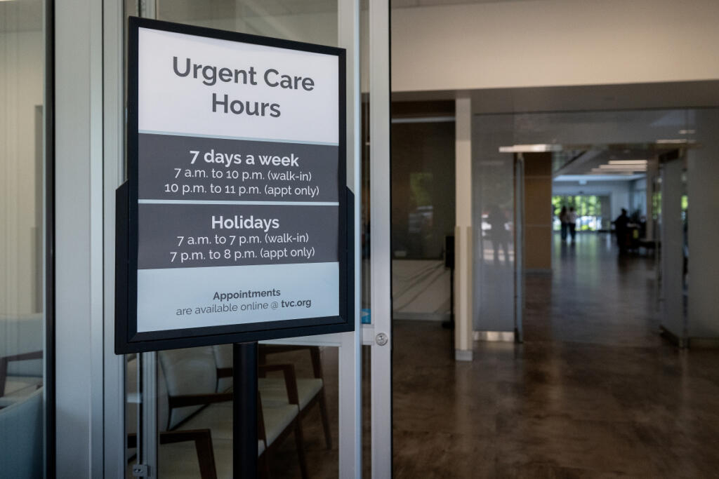 A sign greets patients checking in at Vancouver Clinic&rsquo;s Salmon Creek Urgent Care facility June 4. Vancouver Clinic operates six urgent care facilities in Clark County. (Amanda Cowan/The Columbian)
