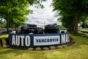 A sign marks the Vancouver Auto Mall, as seen Wednesday. A majority of car loans are now more than six years long. (Photos by Taylor Balkom/The Columbian)