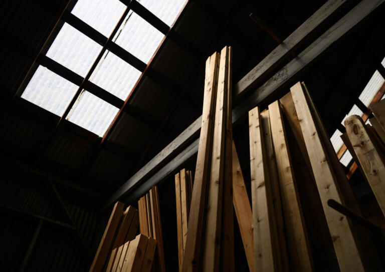 Finished wood sits under a skylight June 11 at Washougal Lumber Co. in Washougal. The 117-year-old business is closing at the end of June.