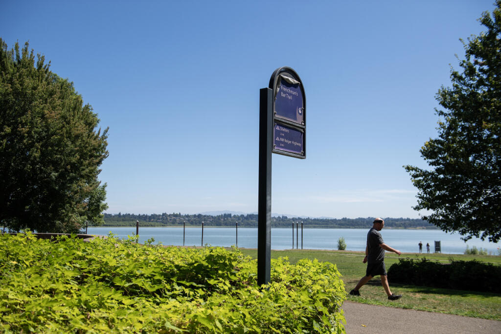 A pedestrian strolls through Vancouver Lake Regional Park in July 2025. Clark County is rolling out a new program that will let businesses and organizations offer fitness classes, guided activities, educational programs, recreation opportunities, and food and beverage sales in parks for a fee.