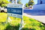 A sign sits in front of the future Washougal Community Library site in downtown Washougal on May 27. (Doug Flanagan/The Columbian files)