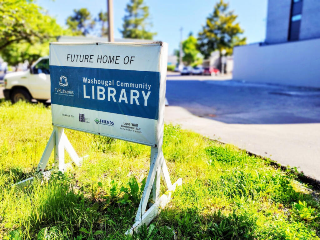 A sign sits in front of the future Washougal Community Library site in downtown Washougal on May 27. (Doug Flanagan/The Columbian files)