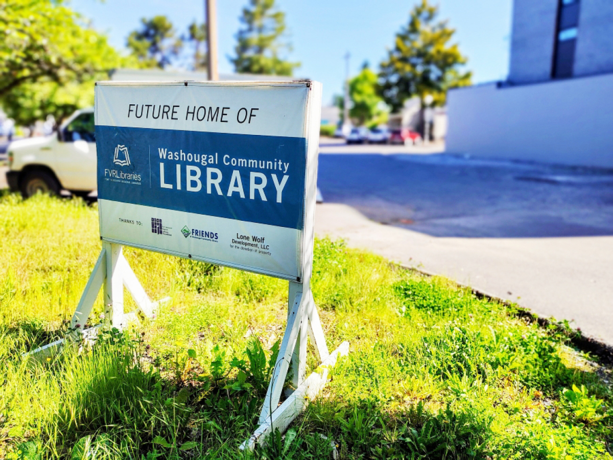 A sign sits in front of the future Washougal Community Library site in downtown Washougal on May 27. (Doug Flanagan/The Columbian files)