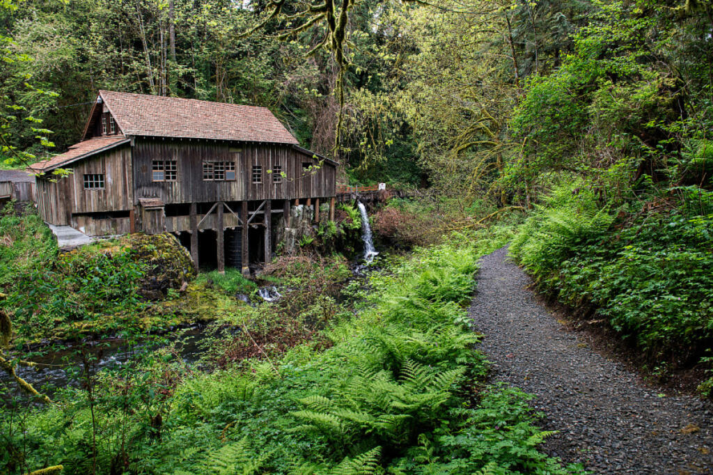 A misty, springtime rain blankets the Woodland area as the Cedar Creek Grist Mill shows signs of the season April 24, 2020. The mill was built in 1876 and is listed on the National Register of Historic Places. (Amanda Cowan/The Columbian files)