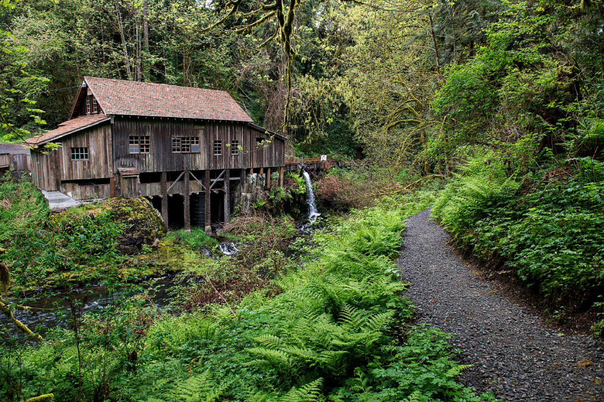 A misty, springtime rain blankets the Woodland area as the Cedar Creek Grist Mill shows signs of the season April 24, 2020. The mill was built in 1876 and is listed on the National Register of Historic Places. (Amanda Cowan/The Columbian files)