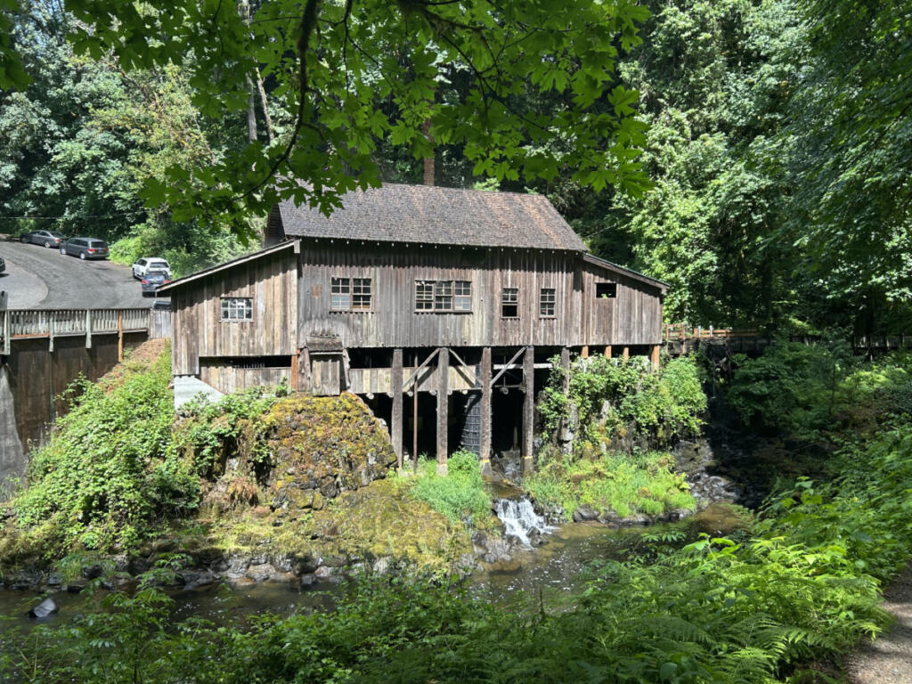 The historic Cedar Creek Grist Mill in Woodland is seen from a viewpoint across Cedar Creek on Saturday afternoon. Volunteers are raising money to repair the mill&rsquo;s aging roof. (Kelly Moyer/The Columbian)
