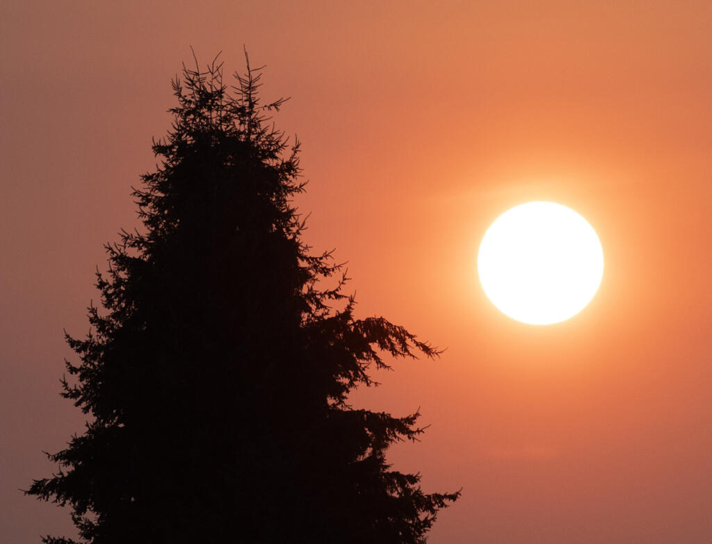 The setting sun illuminates a wildfire smoke-filled sky on Sept. 6, 2024, at Columbia River High School. (Taylor Balkom/The Columbian files)