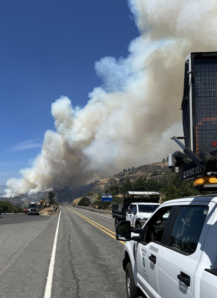 Smoke from the 2025 Burdoin Fire towers over the closed state Highway 14 in the Columbia River Gorge. The blaze had burned nearly 11,000 acres. (Contributed by the Washington State Department of Transportation)