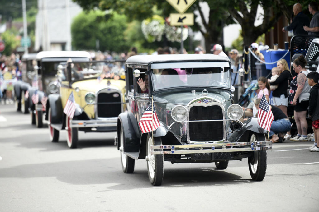 Classic cars roll down Northeast Fourth Avenue during the 2025 Camas Days Grand Parade. (Tim Martinez/The Columbian files)