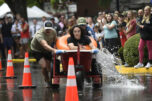 Members of the Utterly Unstoppable Lactose Legends sprint to victory in the Bathtub Races during Camas Days in downtown Camas on July 26, 2025. The annual festival will mark its 50th anniversary this year. The two-day event attracts roughly 15,000 people. (Photos by Tim Martinez/The Columbian files)
