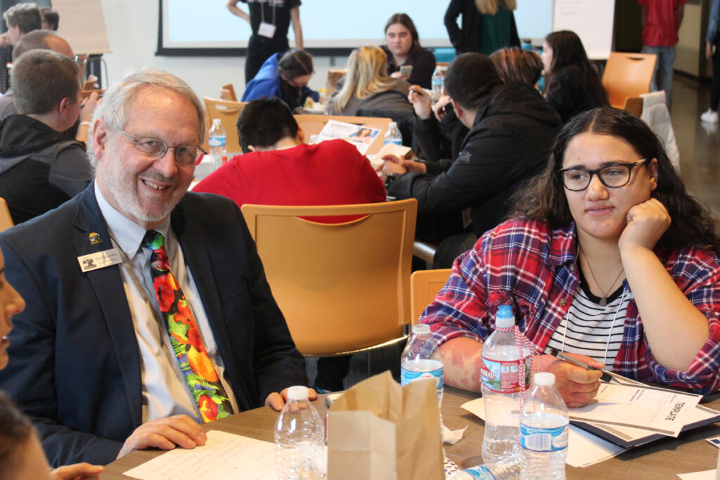 Washougal City Councilor Paul Greenlee, left, eats lunch with Olivia McKinney, 15, a Washougal High sophomore, at a Dec. 21, 2018, &ldquo;Use Your Voice&rdquo; workshop at Washougal High&rsquo;s Excelsior building. (Kelly Moyer/Post-Record files)