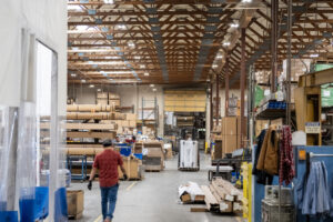 Workers move about the production floor May 4 at medical equipment manufacturer Pedigo. Average annual wages grew modestly in Clark County this year, with manufacturing seeing a roughly 5.5 percent increase. (Taylor Balkom/The Columbian files)