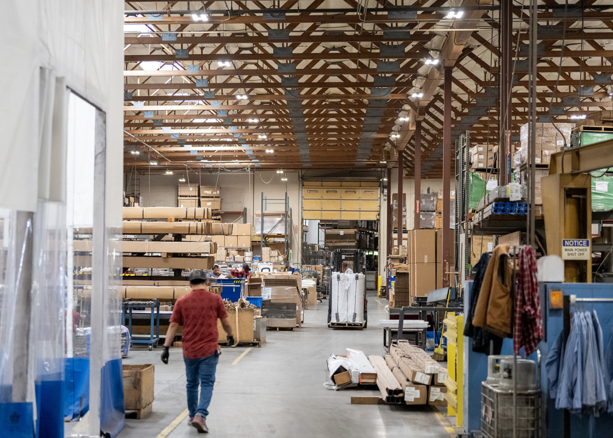 Workers move about the production floor May 4 at medical equipment manufacturer Pedigo. Average annual wages grew modestly in Clark County this year, with manufacturing seeing a roughly 5.5 percent increase. (Taylor Balkom/The Columbian files)