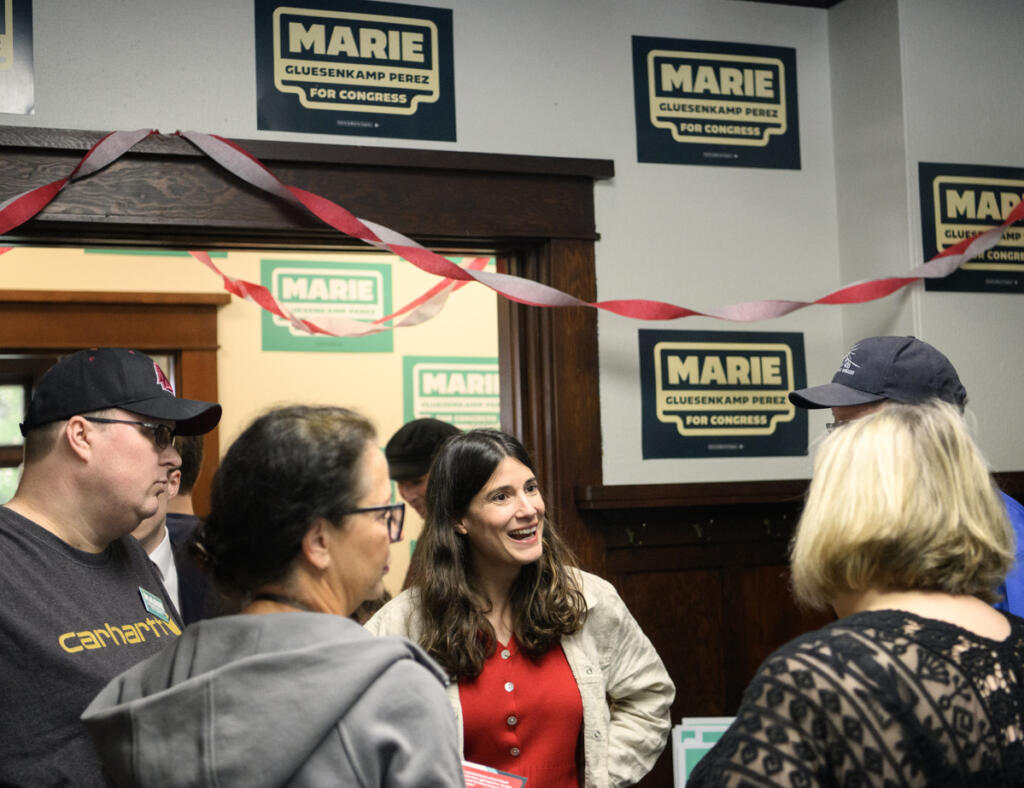 U.S. Rep. Marie Gluesenkamp Perez, D-Skamania, center, chats with supporters May 17 during a campaign volunteer event in Vancouver. She is seeking a third term, but faces challengers from the left, right and center. (Taylor Balkom/The Columbian)