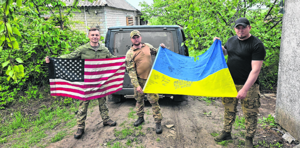 Mikhail Pavenko, left, with soldiers of the First Separate Marine Battalion of Ukraine. &ldquo;I carry an American flag with me to Ukraine on all of my rotations,&rdquo; Pavenko said. &ldquo;The people of Ukraine are incredibly thankful to the American people for their support.&rdquo; (Contributed by Mikhail Pavenko)