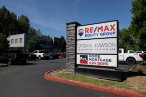 A sign is seen for Opsahl Dawson outside the building Monday morning. (Amanda Cowan/The Columbian)