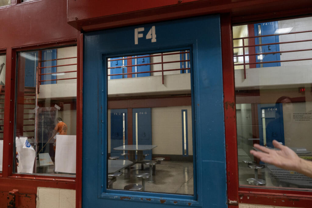An inmate sweeps the floor in a maximum-security area of the Clark County Jail on Thursday morning. (Photos by Amanda Cowan/The Columbian)