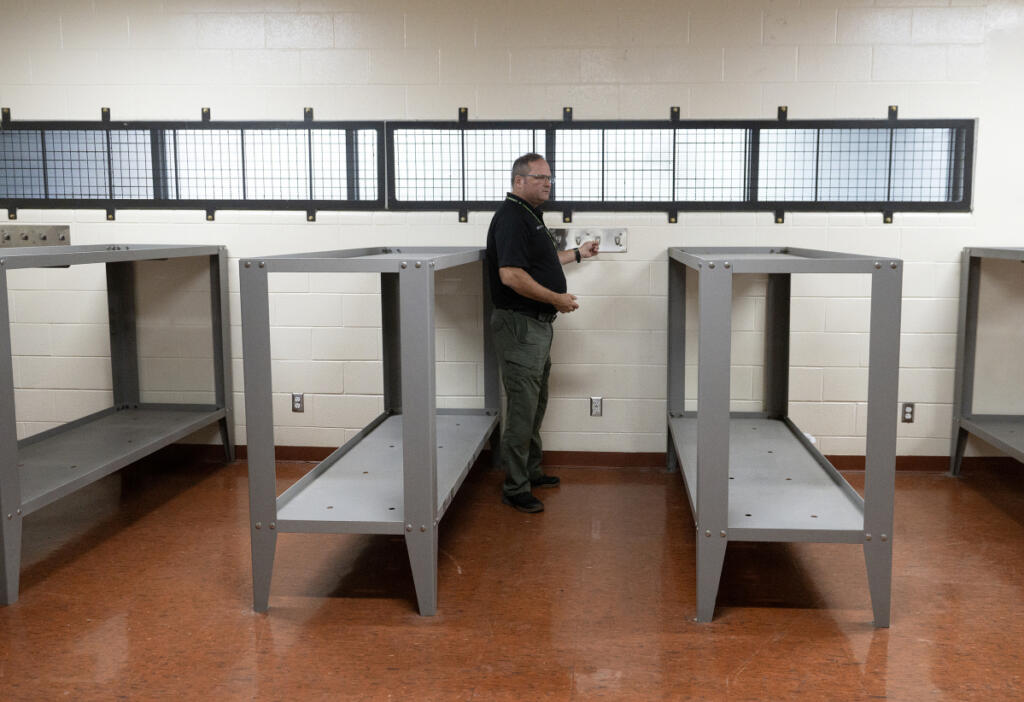David Shook, director of jail services, shows an example of dormitory space during a tour of the Clark County Jail on July 2. The county council is set to vote on July 21 to solidify the partial remodel of the jail, but the general voting public in Clark County doesn&rsquo;t know the status of the jail and is hesitant to support a new tax.