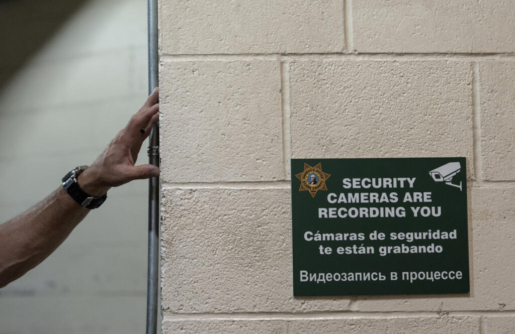David Shook, director of jail services, looks over aging paint in the Clark County Jail on Thursday morning.