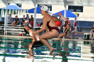 Competitors jump off the blocks with a cannonball dive to start the 200-meter freestyle at the Camas High Alumni swim meet Friday at Gold&rsquo;s Gym Camas. (Tim Martinez/The Columbian)