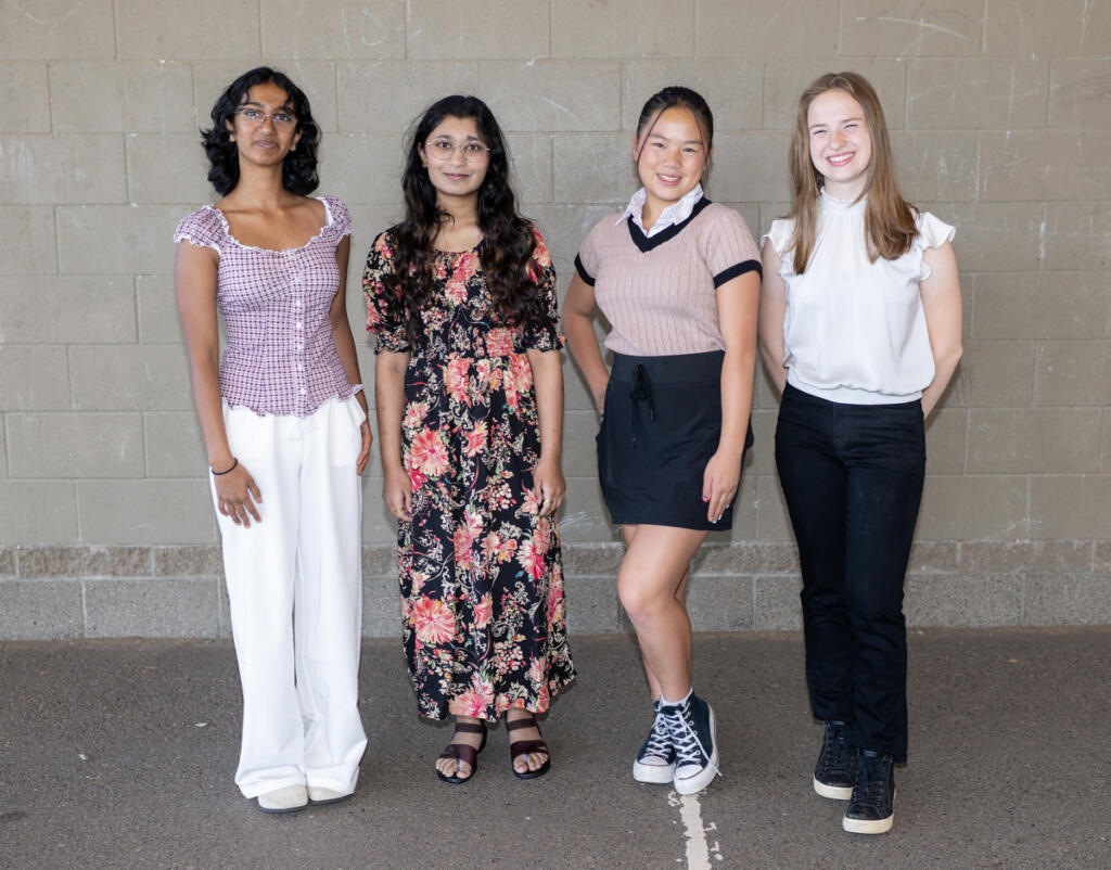 Camas High School students Roshni Madugula, 15, from left, Srijani Gireddy, 17, Abigail Lim, 15, and Brittan Fine, 15, stand for a portrait Friday at Prune Hill Sports Park in Camas.