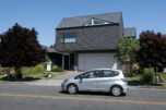 A motorist drives past a home for sale in Ridgefield on Monday morning. As the war in Iran rages on, inflation and interest rates remain high, keeping many buyers out of the real estate market. (Photos by Amanda Cowan/The Columbian)