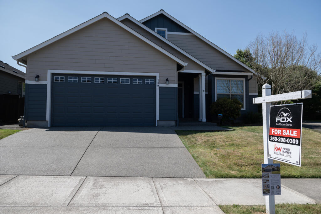 A home for sale is pictured in Ridgefield on Monday morning. Pending sales fell 2.7 percent in June, compared with a year ago. (Amanda Cowan/The Columbian)