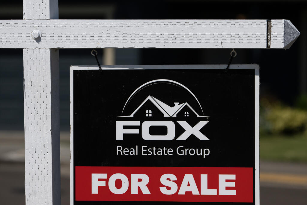A sign advertises a home for sale in Ridgefield on Monday morning.