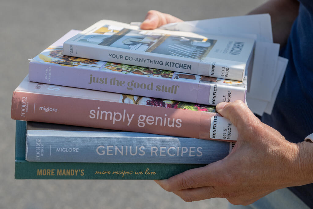 Lindsey Sinner of Felida leaves Three Creeks Community Library in Salmon Creek after checking out cookbooks on Tuesday morning.