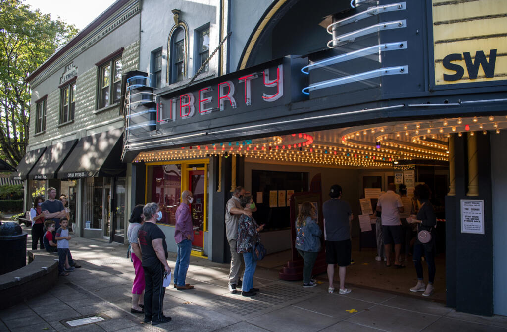 Masked moviegoers line up for an afternoon screening of &ldquo;The Goonies&rdquo; during the pandemic-era reopening of the Liberty Theatre in Camas in October 2020. (The Columbian files)