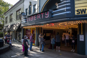 Masked moviegoers line up for an afternoon screening of &ldquo;The Goonies&rdquo; during the pandemic-era reopening of the Liberty Theatre in Camas in October 2020. (The Columbian files)