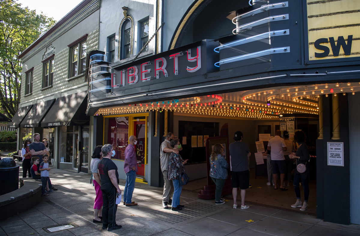 Masked moviegoers line up for an afternoon screening of &ldquo;The Goonies&rdquo; during the pandemic-era reopening of the Liberty Theatre in Camas in October 2020. (The Columbian files)