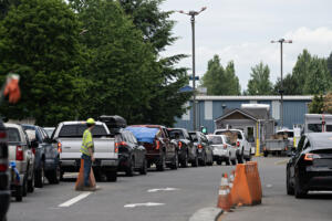 Drivers wait in line at the Central Transfer and Recycling Center in northeast Vancouver. The county council on Tuesday hired consultants to look at creating a regional solid waste utility, which could include purchasing Waste Connections Central and West Vancouver transfer stations. (Amanda Cowan/The Columbian files)