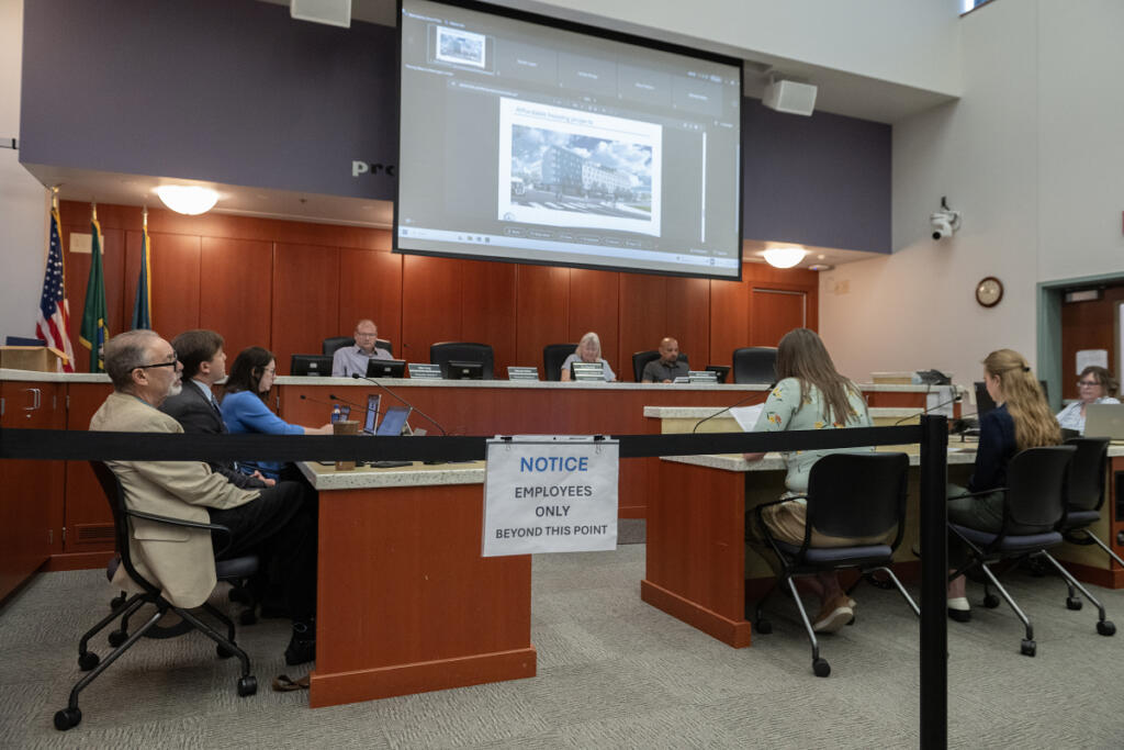 Dr. Alan Melnick, left, attends a meeting at the Public Service Center on June 24. (Amanda Cowan/The Columbian files)