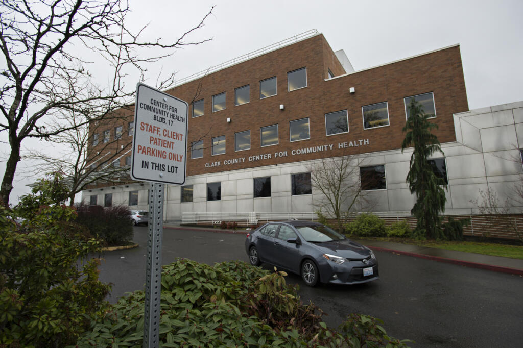 A motorist drives past the Clark County Public Health building Feb. 5, 2020. (Amanda Cowan/The Columbian files)