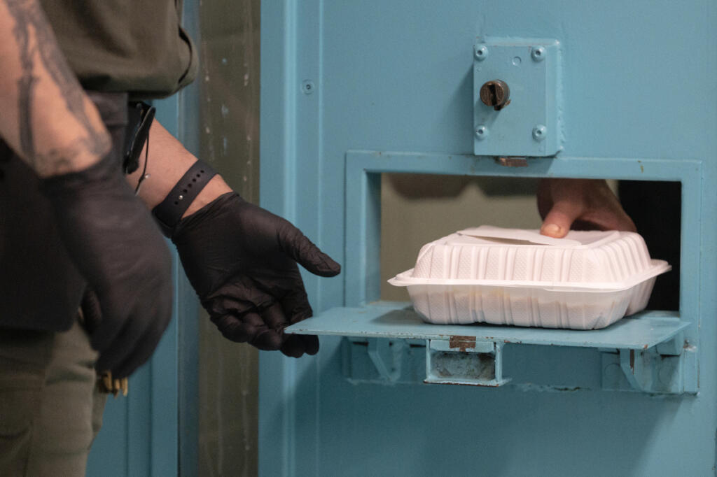 An inmate is served lunch while in custody at the Clark County Jail, as seen July 2. The jail currently has 519 beds and 435 were occupied at the beginning of the month.