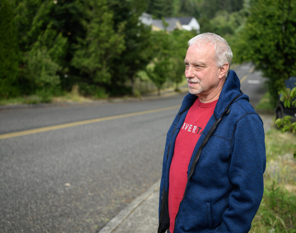 Resident Tim Taylor stands for a portrait June 30 along W Street in Washougal. Taylor has been fighting to get speeding under control along W Street since 2021. (Taylor Balkom/The Columbian)