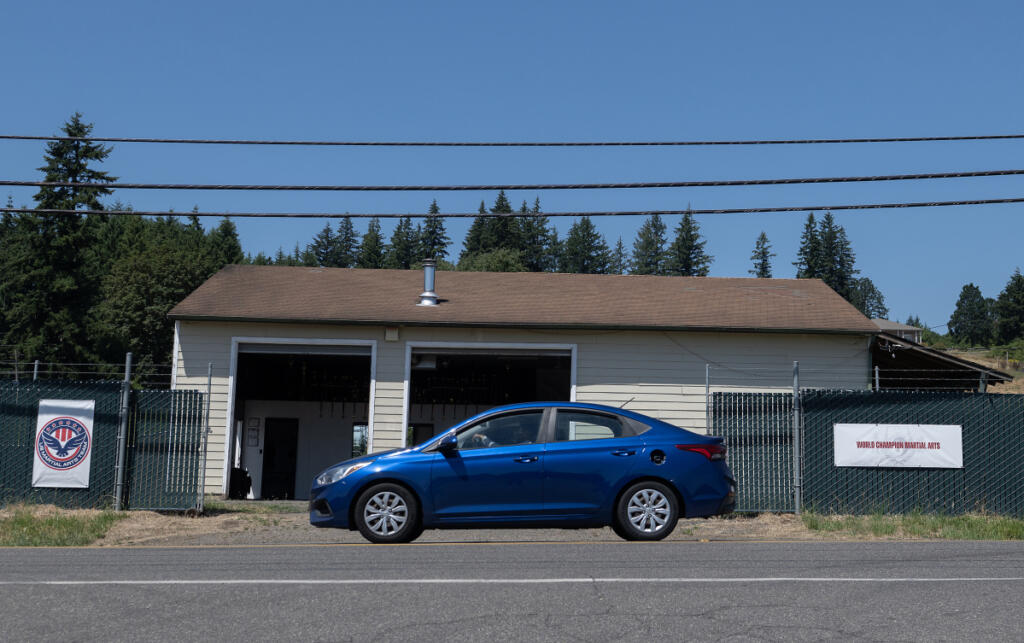 A motorist passes by Cropper Martial Arts and Fitness on July 14. (Amanda Cowan/The Columbian)